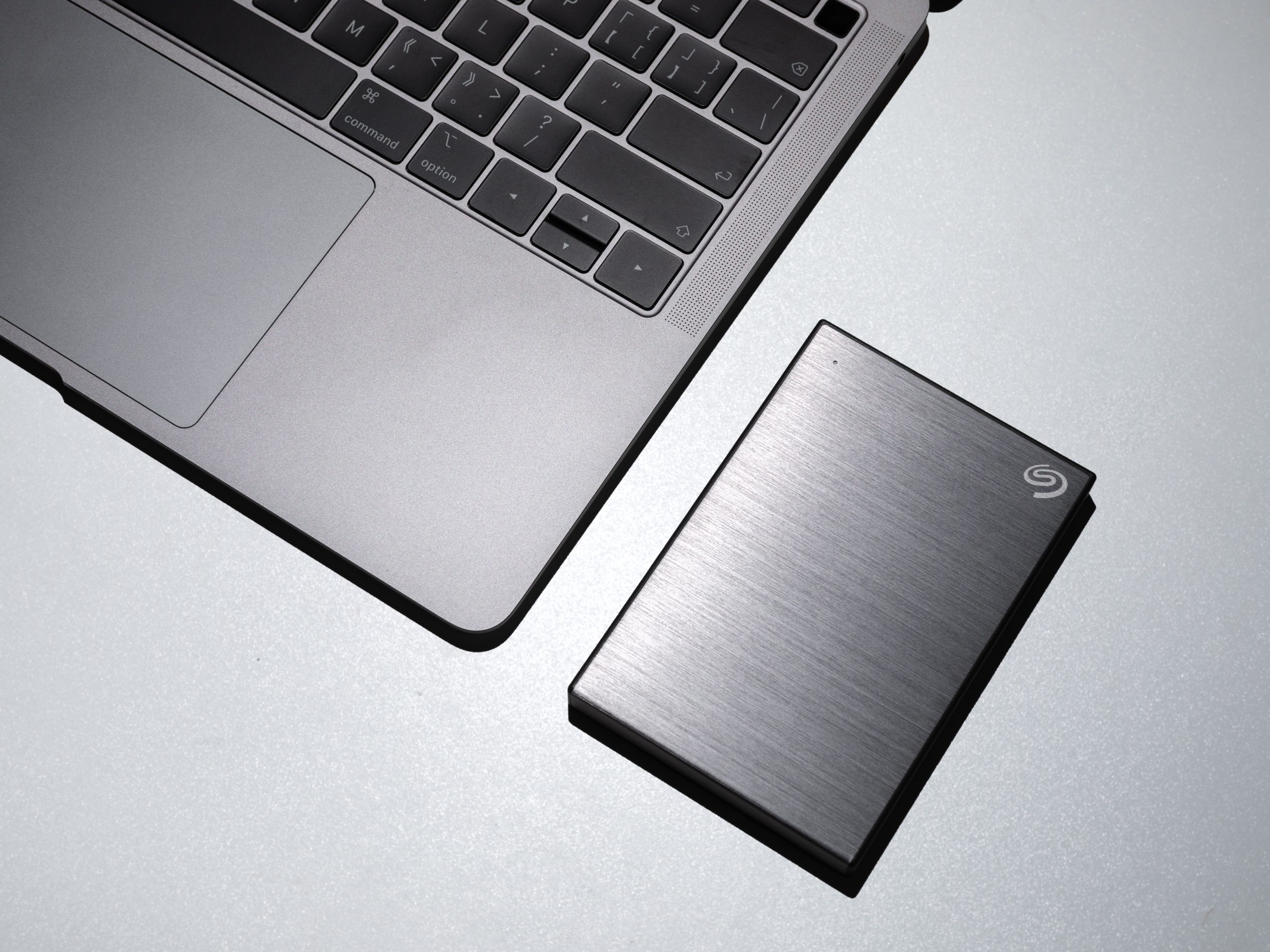 The Basics of Video Editing - An image of a laptop and external drive